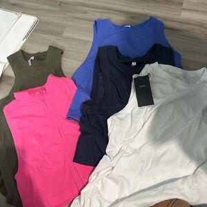 Fabletics Sleeveless Tank Pack in White, Black, Blue, Hot Pink, Olive, Purple